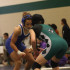Searching for the take down: Junior Mariah Mack positions herself to take down her opponent. Photo by Skylar Campbell.