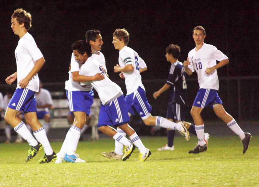 Victory dance:  Junior Jose Molina hugs junior Bryan Arriola as he celebrates scoring the third goal in last game against Cy Ranch, securing victory. The team hadn’t won any district games beforehand. Photo by Dairyn Salguero