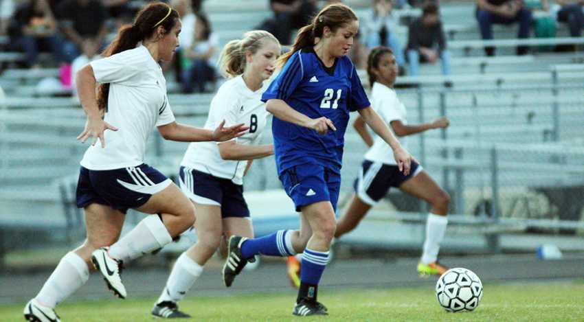 Goal bound:  Junior Alisa Trejo handles the ball in the final district game against Cy Ranch. She ranks as the number two scorer in district. Photo by Dairyn Salguero