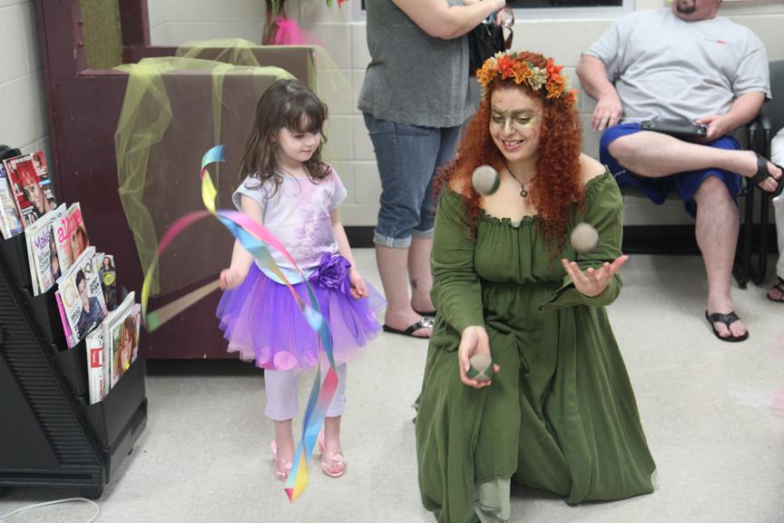 Juggling: Senior Andrea Serving juggles for the campus guests on cosmetologys Princess for the Day fundraiser. Photo by Amber Harris