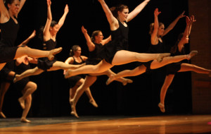 Leaping: Colonel and senior Rachel Lesikar leaps in the front and center. Junior Brittany Fowlkes will take over the Col. position next year. Photo by Veronica Schiebler