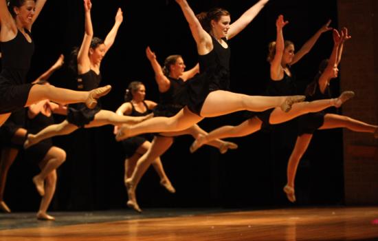 Leaping: Colonel and senior Rachel Lesikar leaps in the front and center. Junior Brittany Fowlkes will take over the Col. position next year. Photo by Veronica Schiebler