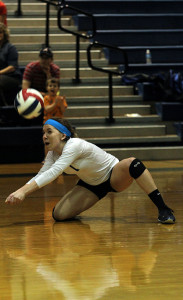 Senior varsity volleyball player Payton Brown dives for the ball during the Cy Ranch game. Creek won the game.