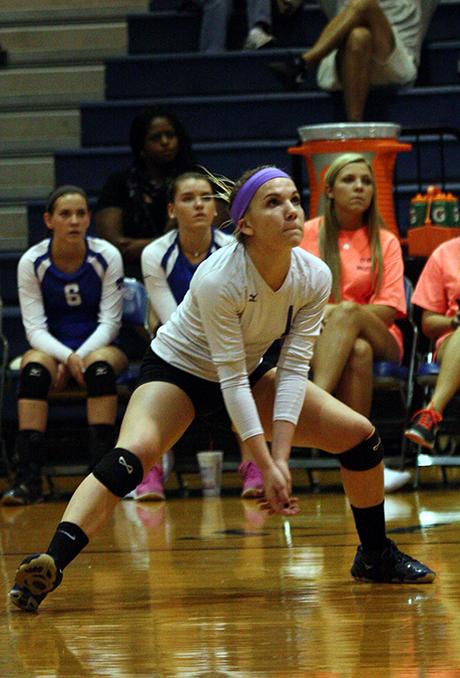 Brown prepares herself to hit the ball back to Cy Woods during the game.