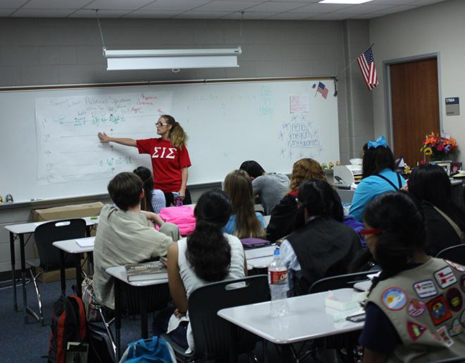 Leading the class: Government teacher Nicole Cuellar explains to her fourth period government AP class an assignment involving the various parts of the political spectrum.