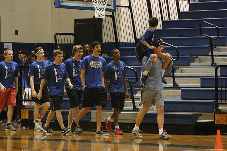 A team marches into the gym ready to compete.