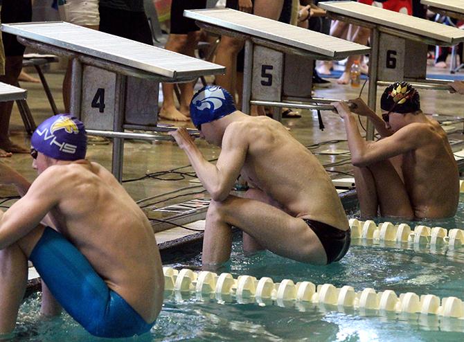 Junior Braxton Flowers about to start off the 200m medley relay. They relay placed first at districts, moving on to the regional meet.