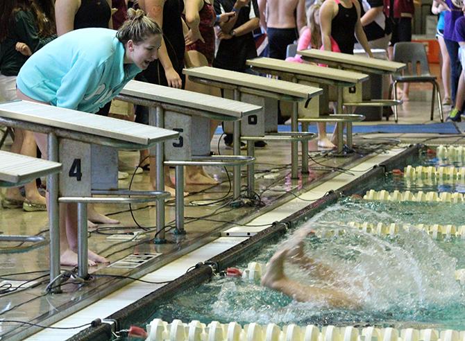 Senior Annie Eubanks cheers on Senior Nikki ODonnell in the 200m freestyle.