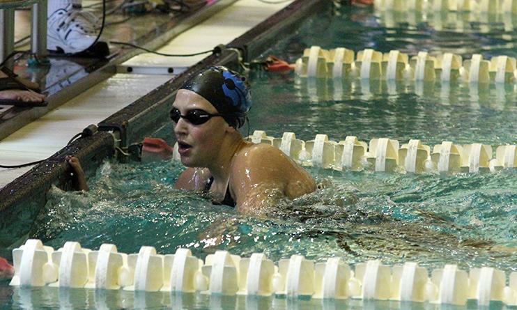 Senior Tori Karker finishing her 200m freestyle race. She placed first overall in the event.