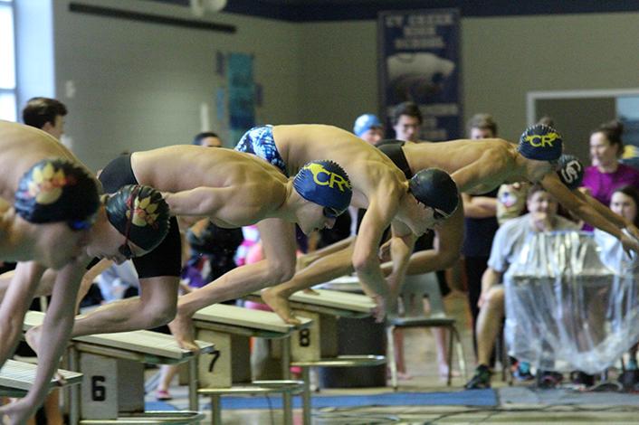 Sophomore Todd Coachman dives off the block to swim the 200m freestyle. He placed fourth overall in the event.