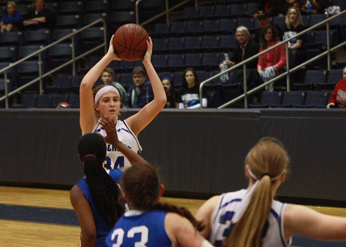 Defensive player of the year passes the ball to another team member. 