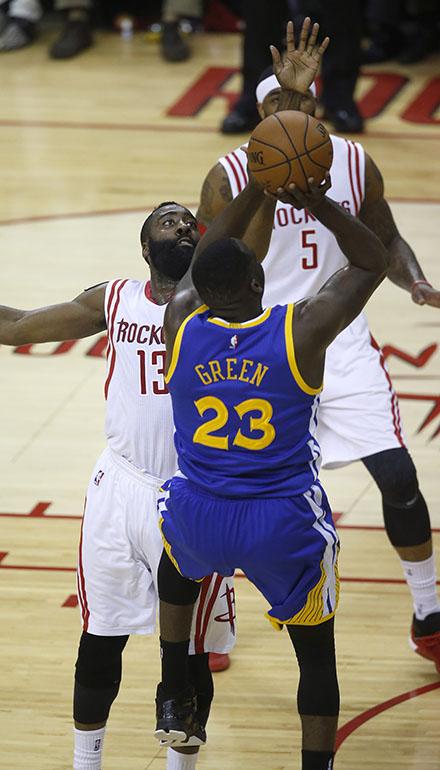 Houston Rockets' James Harden (13) blocks a shot  against Golden State Warriors' Draymond Green (23) during the first quarter of Game 4 of the NBA Western Conference finals on Monday, May 25, 2015, at the Toyota Center in Houston, Texas. (Nhat V. Meyer/Bay Area News Group/TNS)
Photo courtesy of MCT Campus.