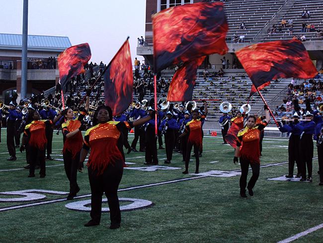 Color guard performs during the halftime show.