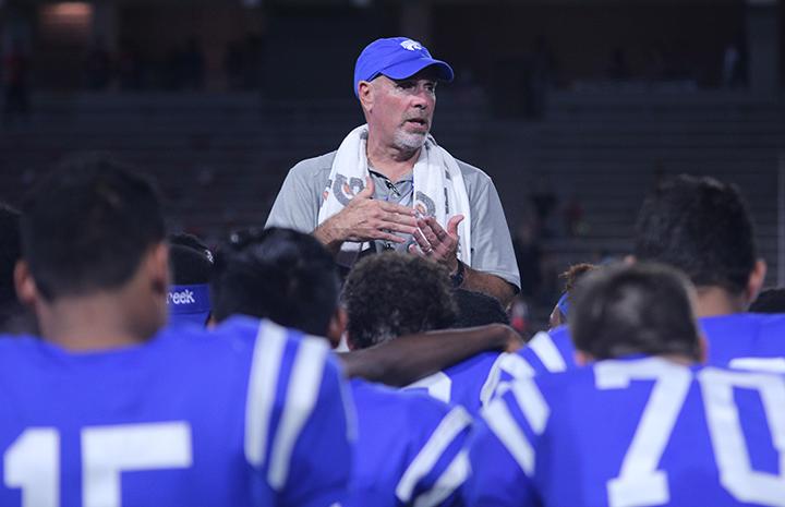 Coach McCaig Talks to the cougars after the game.