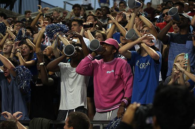 The student section cheer during the Varsity game. 