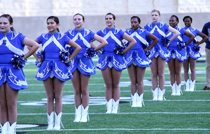 Silvies line up during the football run in before the start of the game.