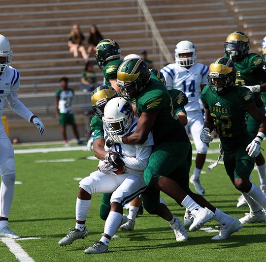 Senior Mason Biggers is tackled during the first quarter. 