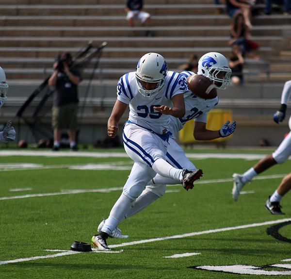 Sophomore Eric Cruz kicks the ball at the beginning of the first half.