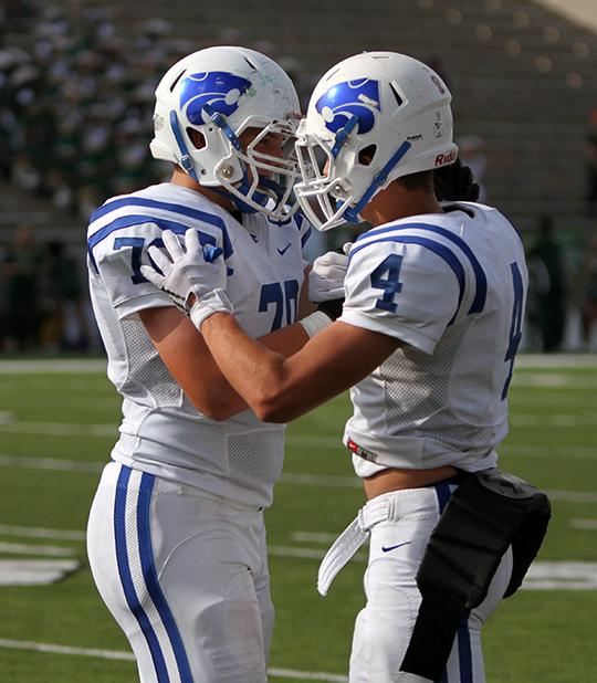 Junior Jack hook congratulates junior William Stephenson.