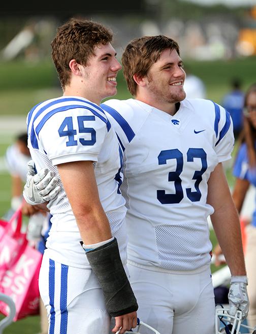 Seniors Mark Hurbanis and Pryce Pearson pose for a photo before their last football game.