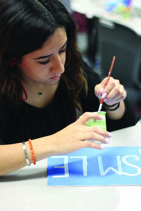 PAL members painting in class