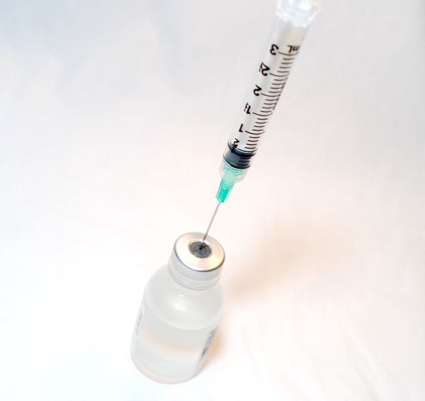 Syringe and Vaccine by NIAID is licensed under CC BY 2.0