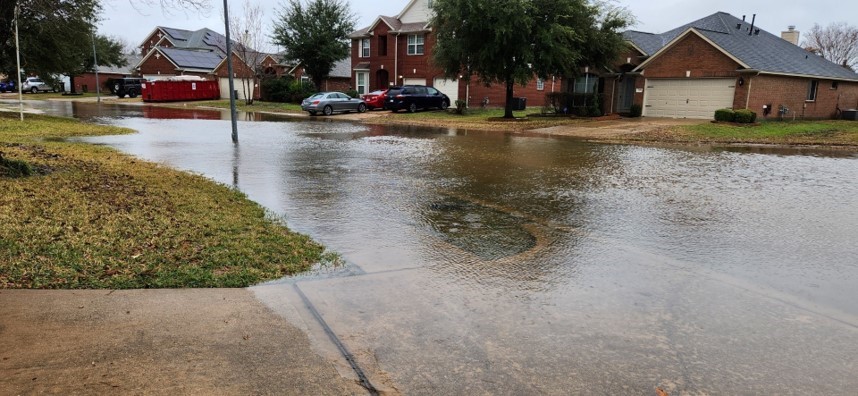 Taylorwood Lane floods following severe weather on Jan. 24, which canceled some after-school activities and impeded students commutes home. Photo by: Anjum Alam