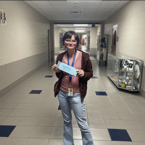 Senior Alyssa Cooke pictured with her prom ticket. Photo by Morgan Myers.