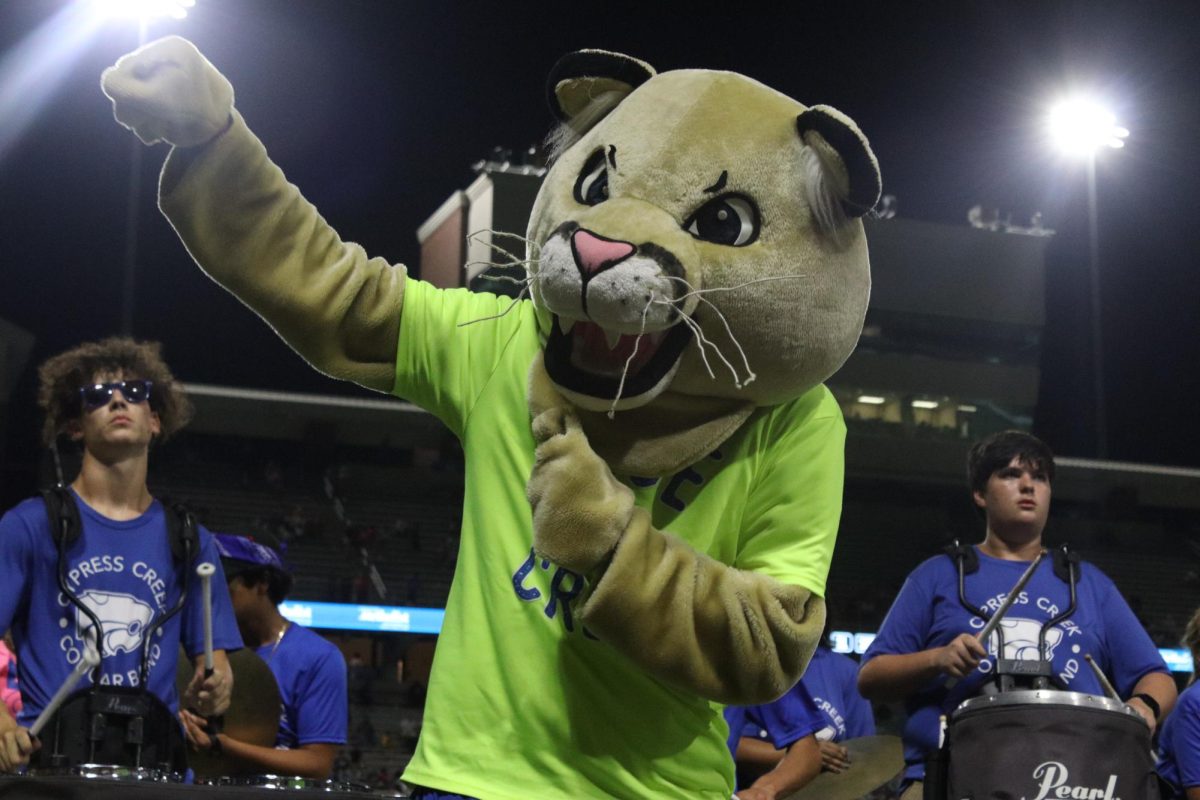 Senior Brendan Sembera performs as Colby the Cougar at the Sept. 7 varsity football game at Pridgeon Stadium.